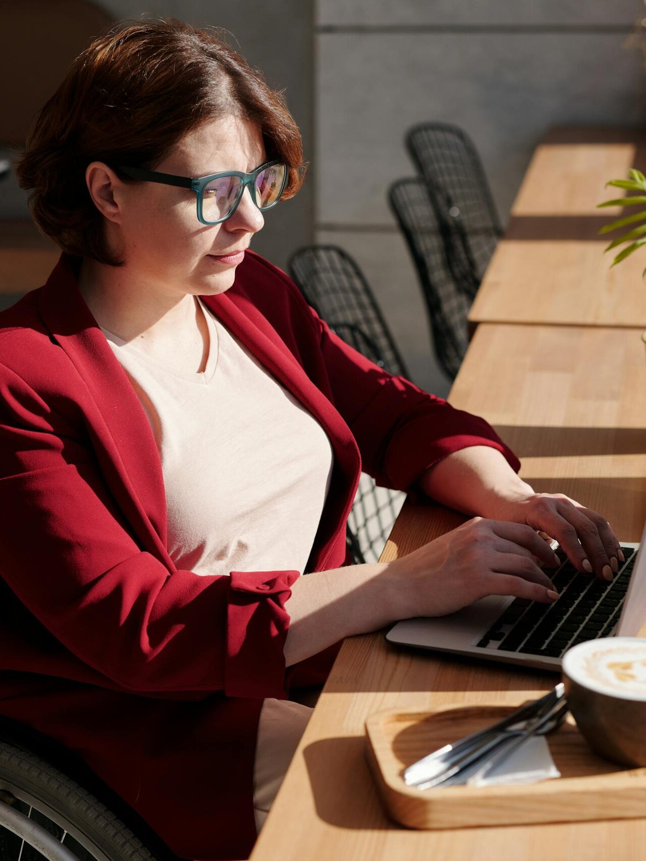 Woman in Red Blazer Sitting on Wheelchair